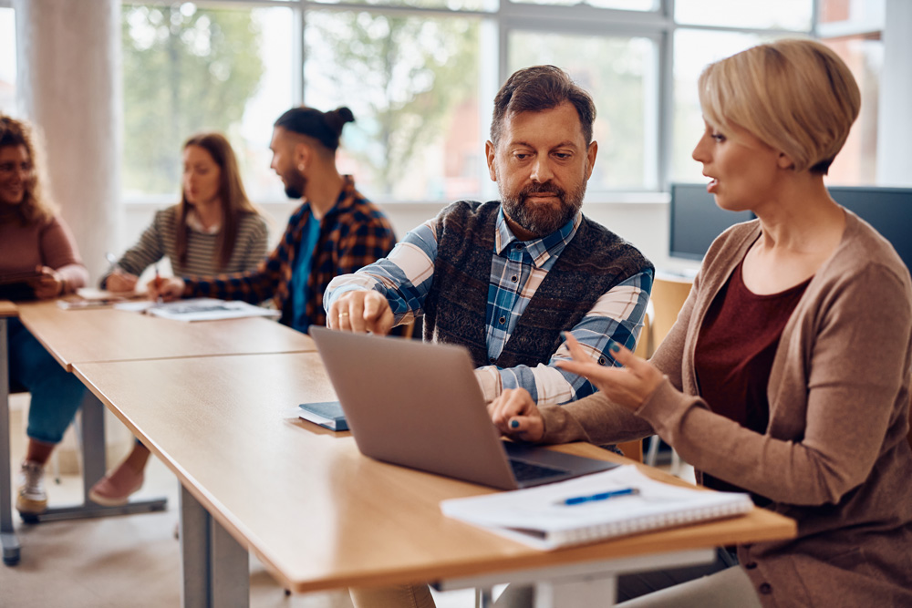 Adults learning in a classroom setting.